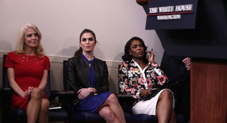 Kellyanne Conway, Hope Hicks, and Omarosa Manigault observe a White House press briefing.