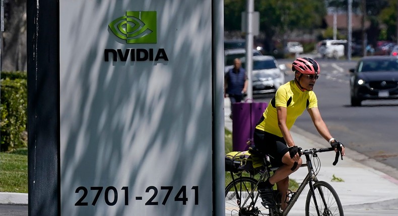 A bicyclist drives past a sign outside of a Nvidia office building in Santa Clara, Calif., Wednesday, May 31, 2023. (AP Photo/Jeff Chiu)Jeff Chiu/AP Photo