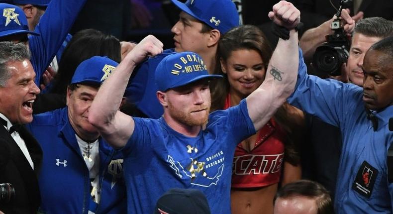 Saul 'Canelo' Alvarez celebrates after defeating Julio Cesar Chavez Jr. by unanimous decision in their catchweight bout, at T-Mobile Arena in Las Vegas, Nevada, on May 6, 2017