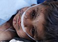 A child receives medical attention during a Medevac mission in southern Afghanistan's Helmand province November 13, 2010. The child was injured in an explosion.