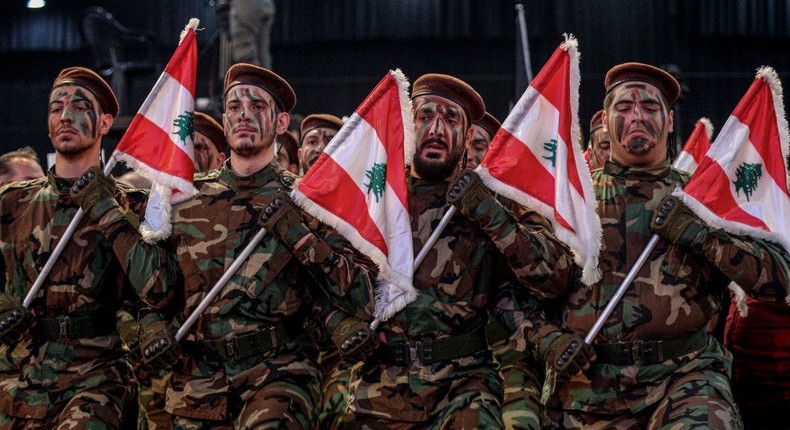 Hezbollah militants parade during a ceremony.Marwan Naamani/picture alliance via Getty Images