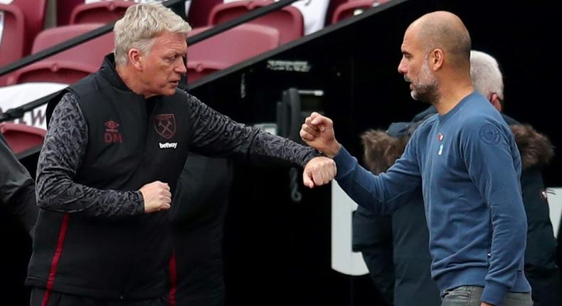 Pep Guardiola (right) has praised the work of David Moyes at West Ham