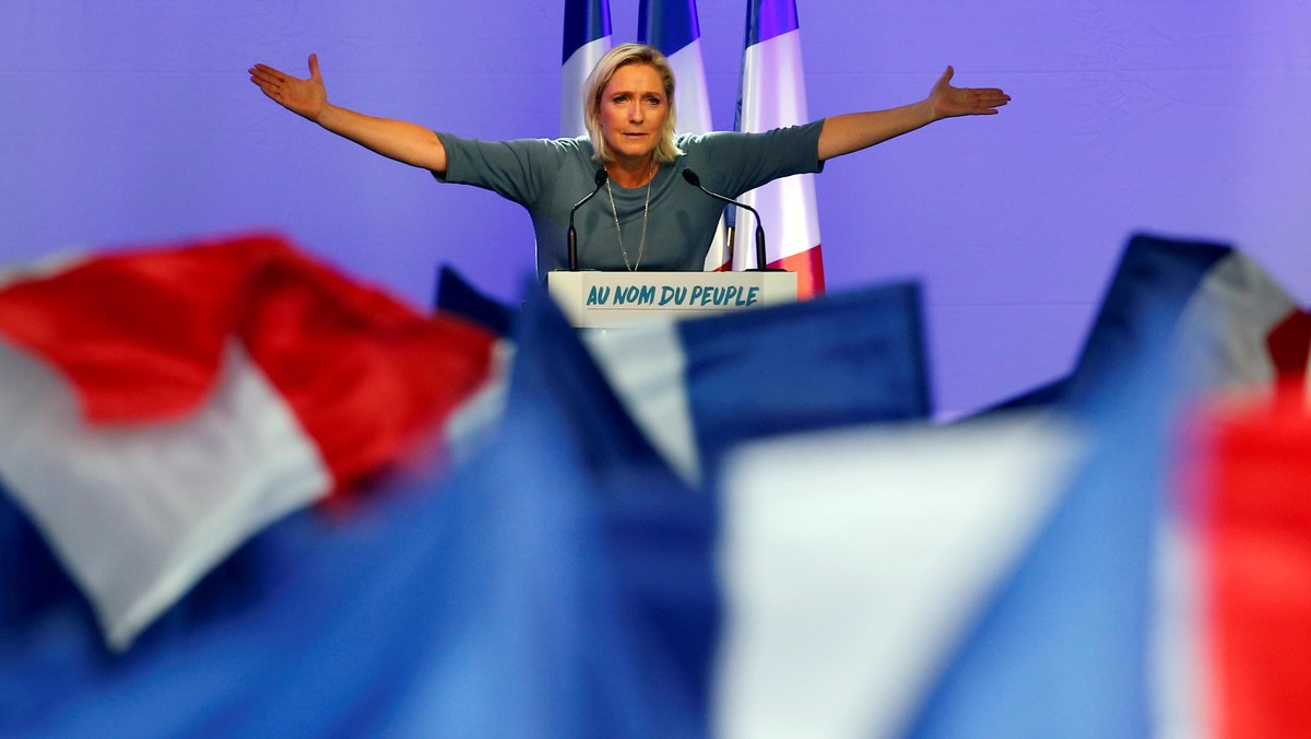 FILE PHOTO: Marine Le Pen, French National Front (FN) political party leader, gestures during an FN political rally in Frejus