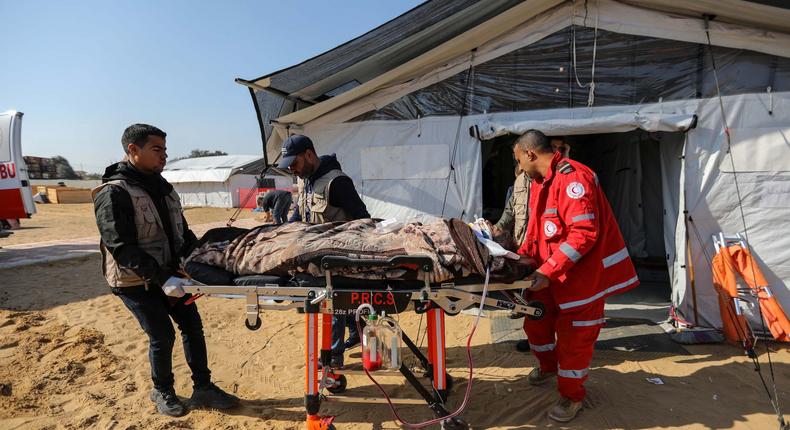Patients receive treatment in a field hospital built by the International Medical Corps on January 16, 2024 in Rafah, Gaza.Ahmad Hasaballah/Getty Images