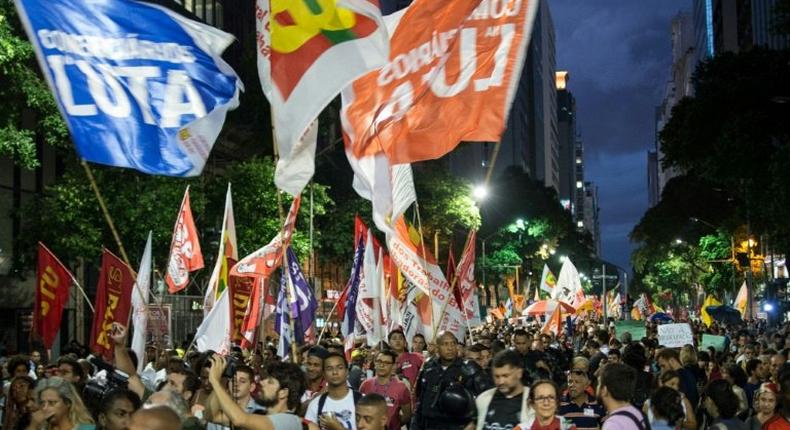 Demonstrators march in Rio de Janeiro against a social welfare reform bill introduced by the government of President Michel Temer
