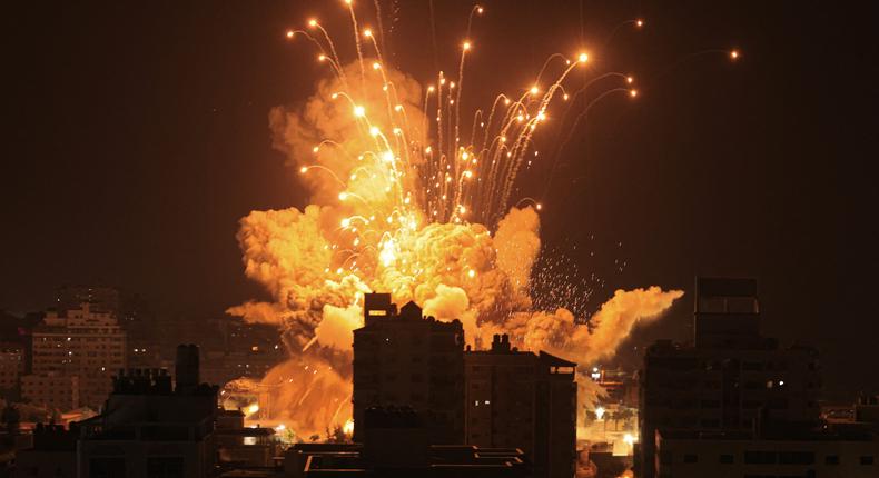 A missile explodes in Gaza City during an Israeli air strike on October 8, 2023.MAHMUD HAMS/AFP via Getty Images
