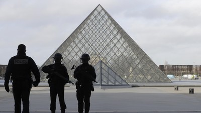 French police secure the site near the Louvre Pyramid in Paris