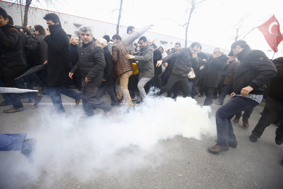 Riot police use tear gas to disperse protesting employees and supporters of Zaman newspaper at the courtyard of the newspaper's office in Istanbul, Turkey March 5, 2016.