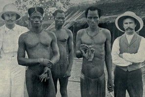 Atrocities of the Rubber Slavery in the Belgian Congo. Natives hold the severed hands of two country