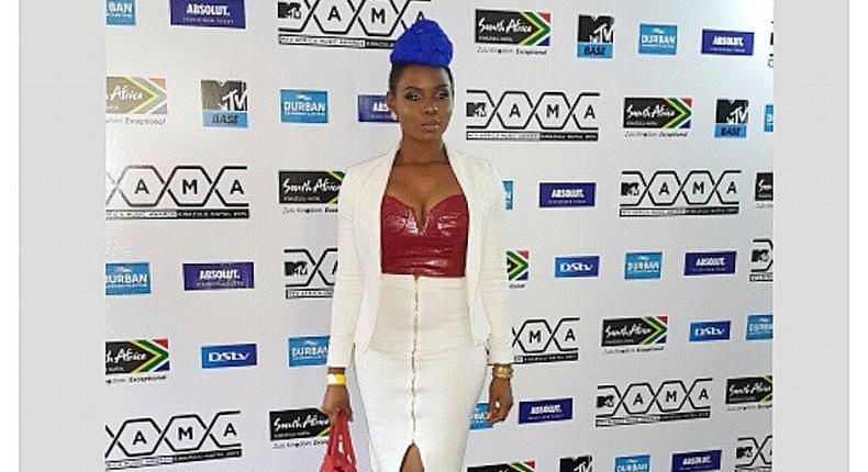 Yemi Alade rocks cobalt blue bun yesterday at an a event in Lagos