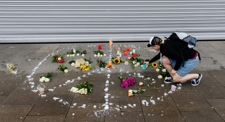 Hamburg residents have laid flowers outside the supermarket where the attack took place