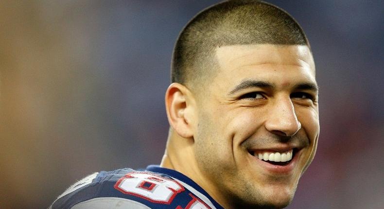 Former New England Patriots tight end Aaron Hernandez, pictured in December 2012, is currently serving a life sentence in prison without parole for murdering Odin Lloyd, a semi-pro football player in June 2013