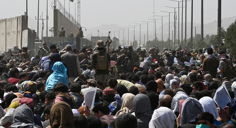 Thousands gather outside Kabul airport in hopes of getting on evacuation flight.
