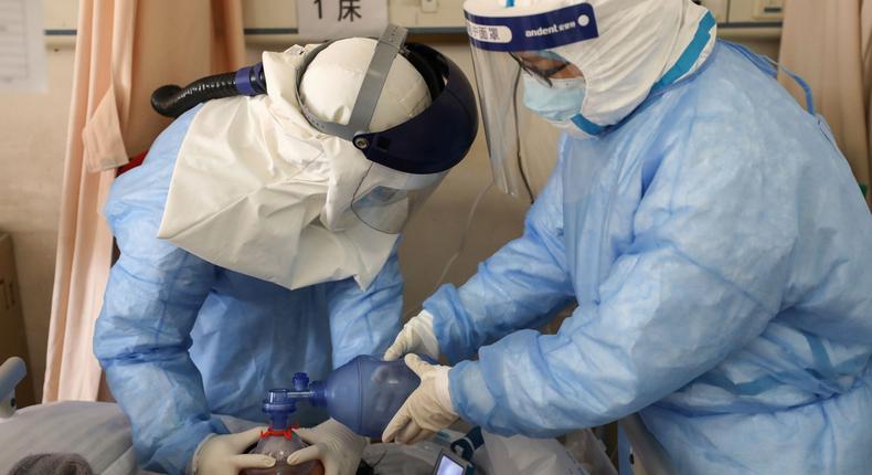 A file image of medics attending to a Chinese patient in Wuhan where the coronavirus was first recorded