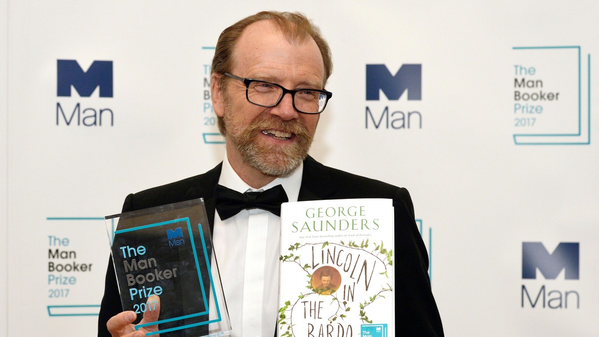 George Saunders, author of 'Lincoln in the Bardo', poses for photographers after winning the Man Booker Prize for Fiction 2017 in London