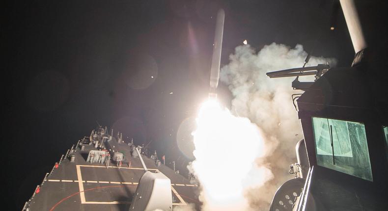 The US Navy guided-missile destroyer USS Ross (DDG 71) fires a Tomahawk cruise missile in what the Defense Department said was a part of a strike against Syria on April 7.