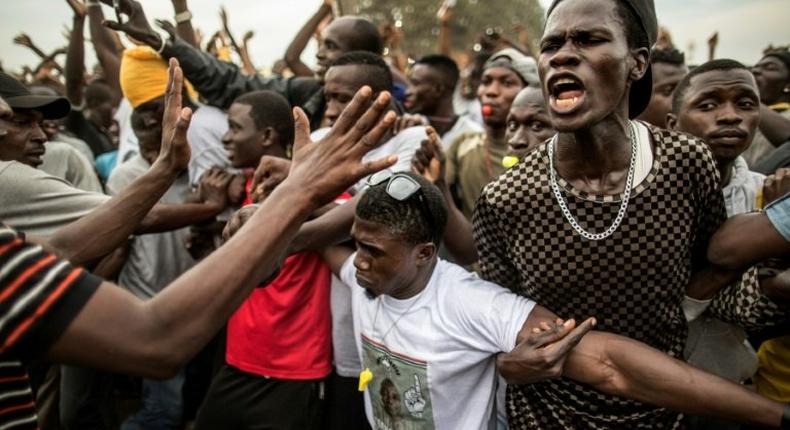 Supporters of now-President Adama Barrow demonstrate on the last day of his presidential campaign in Gambia