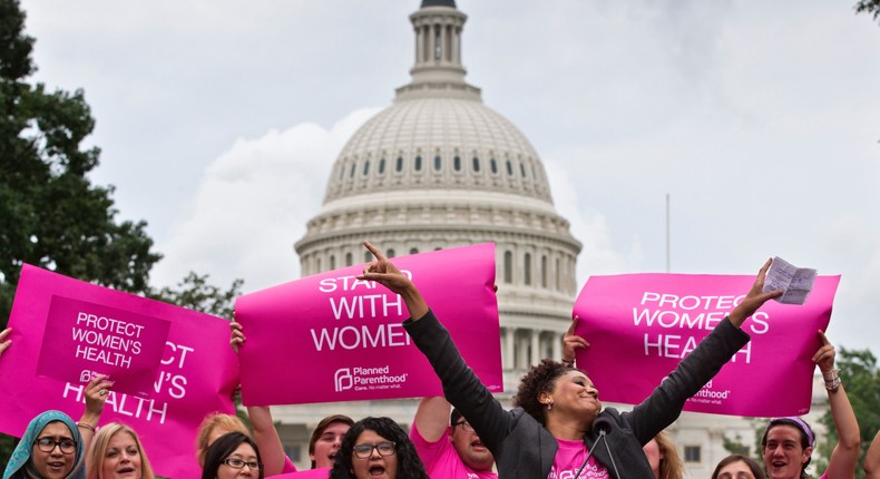 Cheered on by Carol McDonald from Planned Parenthood Federation of America, women rally on Capitol Hill in Washington on July 11, 2013.