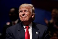 Republican presidential nominee Donald Trump is seen on stage during a campaign town hall meeting in