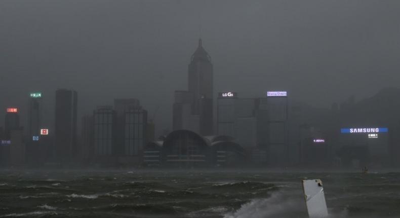 Hong Kong's skyline seen across Victoria harbour had a dark, foreboding air as Severe Typhoon Hato smashed through the city