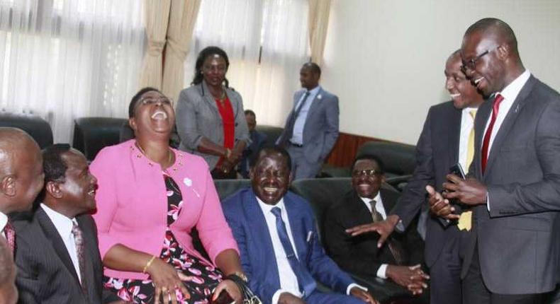 MP Aisha Jumwa shares a light moment with a section of Opposition MPs