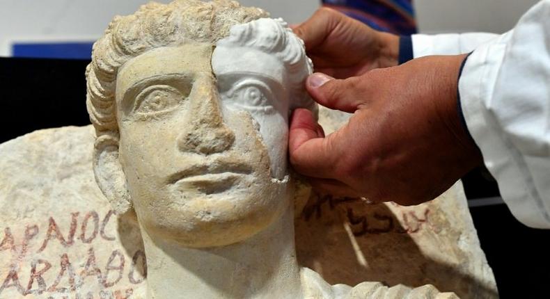 A male bust rescued from the Islamic State group in the Syrian city of Palmyra is restored in Rome in February 2017