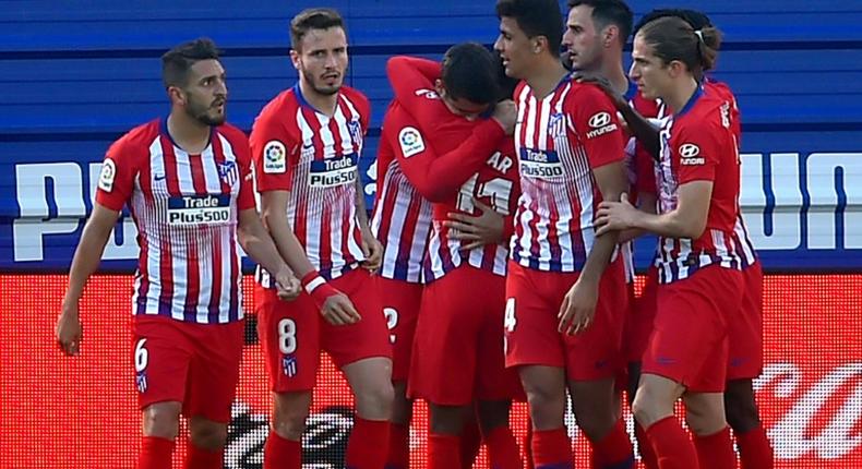 Atletico Madrid's players celebrate Thomas Lemar's winner against Eibar on Saturday.