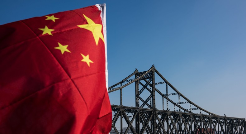 A truck returns over the Friendship Bridge from the North Korean town of Sinuiju to the Chinese border city of Dandong, in China's northeast Liaoning province on January 9, 2018.