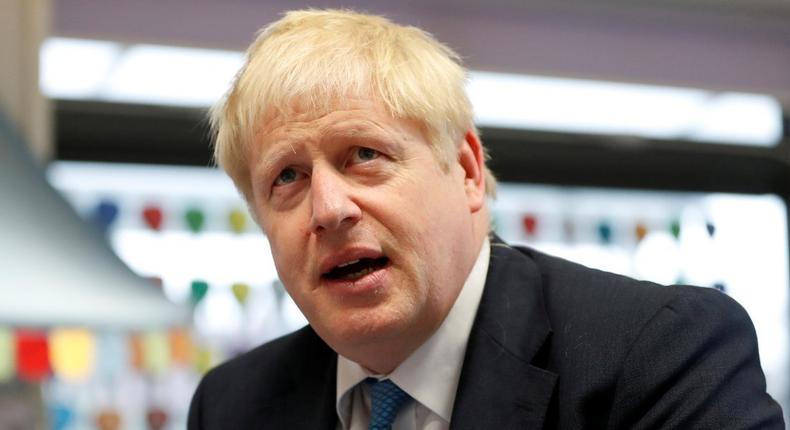 Britain's Prime Minister Boris Johnson participates in an art class during his visit to St Mary's and All Saints Primary School in Beaconsfield, Britain October 11, 2019. Alastair Grant/Pool via REUTERS