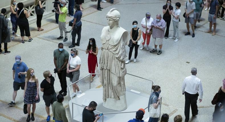 Visitors line up at the entrance to New York's Metropolitan Museum on August 29, 2020 for its reopening after a months-long closing due to the pandemic