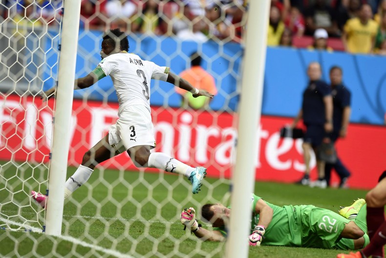 Asamoah Gyan wheels away after scoring against Portugal at the 2014 World Cup