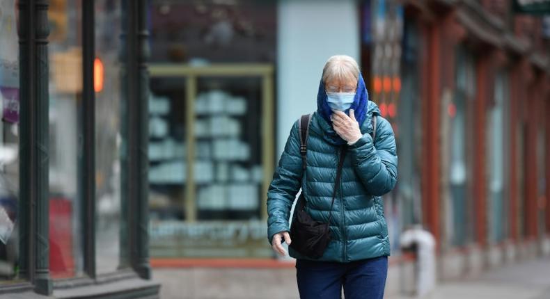 A New Yorker wears a face mask on the street