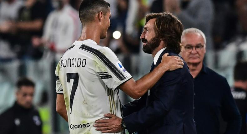 Former Juventus star Andrea Pirlo (R) took over as coach this summer