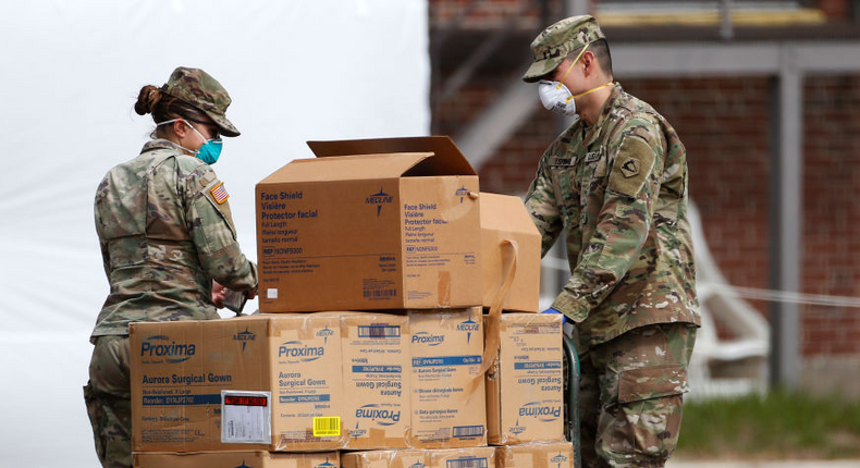 Members of the US Army stack medical supplies