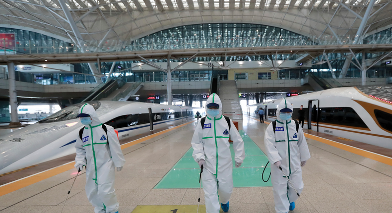 In this photo released by Xinhua News Agency, firefighters conduct disinfection on the platform of Wuhan Railway Station in Wuhan, central China's Hubei Province, March 24, 2020. Chinese authorities said Tuesday they will end a two-month lockdown of most of coronavirus-hit Hubei province at midnight, though the provincial capital will remain closed til April 8, as domestic cases of the virus continue to subside.(Zhao Jun/Xinhua via AP)