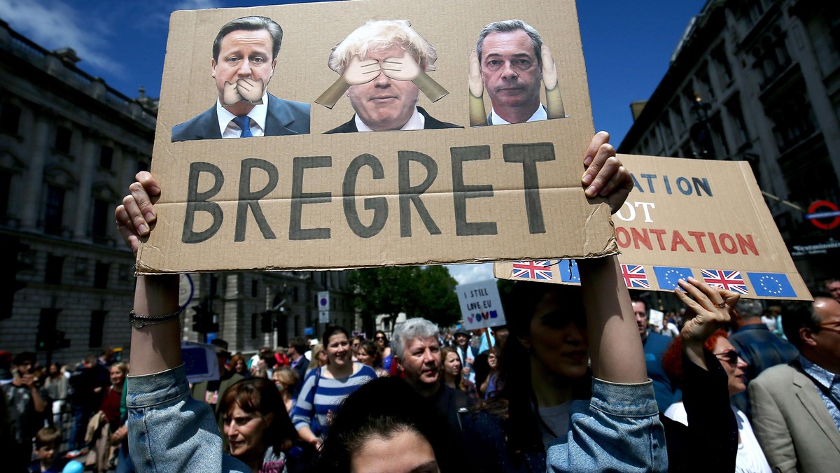 People hold banners during a demonstration against Britain's decision to leave the European Union, i