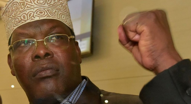 [FILE] Kenyan-born Canadian lawyer Miguna Miguna, gestures as he speaks to journalists at the Jomo Kenyatta International Airport (JKIA) on March 26, 2018, in Nairobi. (Photo by SIMON MAINA/AFP via Getty Images)