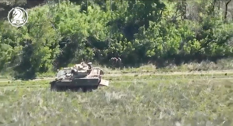 Screengrab from a video showing soldiers helping a wounded soldier into a US-made Bradley infantry fighting vehicle, June 9, 2024.Telegram/@47