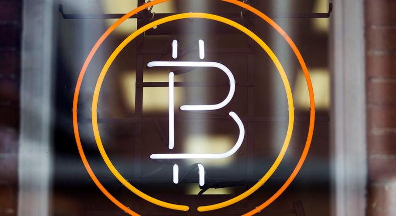 FILE PHOTO - A Bitcoin sign is seen in a window in Toronto