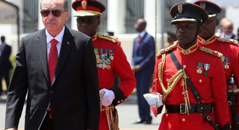 Turkey's President Recep Tayyip Erdogan (L) inspects an honor guard of Tanzania People's Defense Force soldiers during a welcoming ceremony at State House Grounds in Dar es Salaam on January 23, 2017