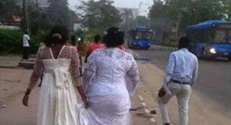 A stranded bride trekking on the expressway as Lagos City Marathon held on Saturday, February 6, 2016