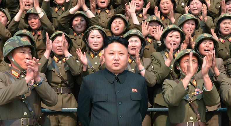 North Korean leader Kim Jong Un receives applause as he guides the multiple-rocket launching drill of women's sub-units under KPA Unit 851, in this undated photo released by North Korea's Korean Central News Agency (KCNA) April 24, 2014.