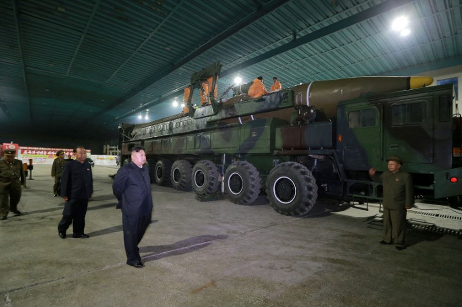North Korean leader Kim Jong Un inspects the intercontinental ballistic missile Hwasong-14 in this undated photo released by KCNA.