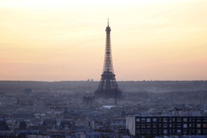 The Eiffel Tower is seen at sunset in Paris