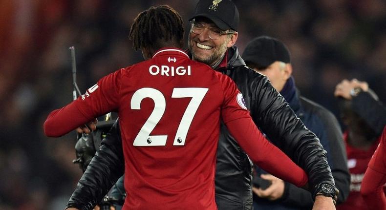 Liverpool manager Jurgen Klopp embraces foward Divock Origi after his late winner against Everton