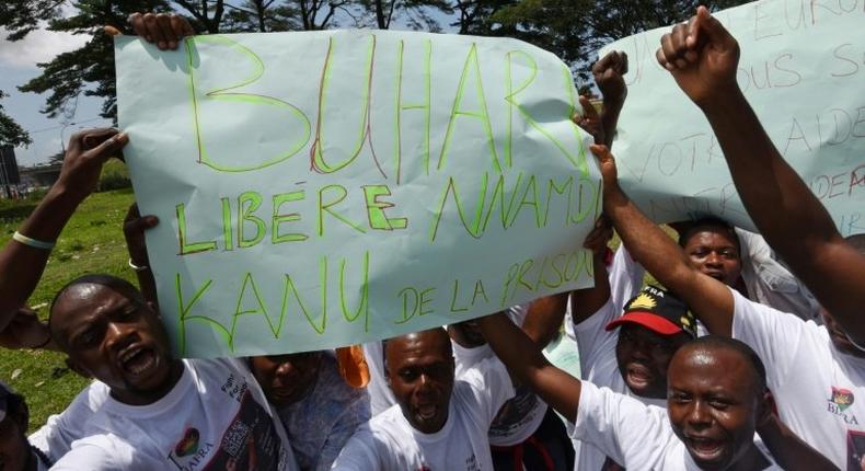 Demonstrators from the Indigenous People of Biafra (IPOB) hold a sign reading Buhari, free Nnamdi Kanu from prison during a protest in the Abidjan suburb of Treichville on September 23, 2016 calling for the release of the pro-Biafra leader