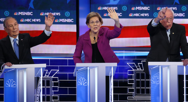 Democratic presidential candidates (L-R) former New York City mayor Mike Bloomberg, Sen. Elizabeth Warren (D-MA) and Sen. Bernie Sanders (I-VT) raise their hands during the Democratic presidential primary debate at Paris Las Vegas on February 19, 2020.