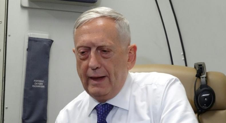 US Defense Secretary James Mattis speaks to reporters on board a flight to Jordan for the start of a regional tour on August 20, 2017