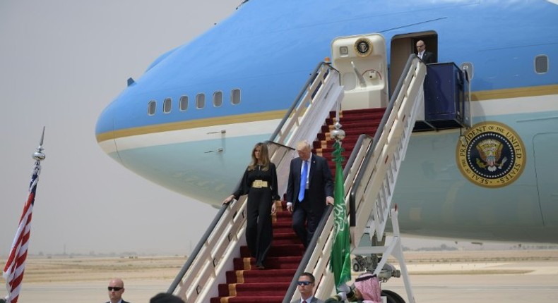 US President Donald Trump and First Lady Melania Trump step off Air Force One upon arrival at King Khalid International Airport in Riyadh on May 20, 2017