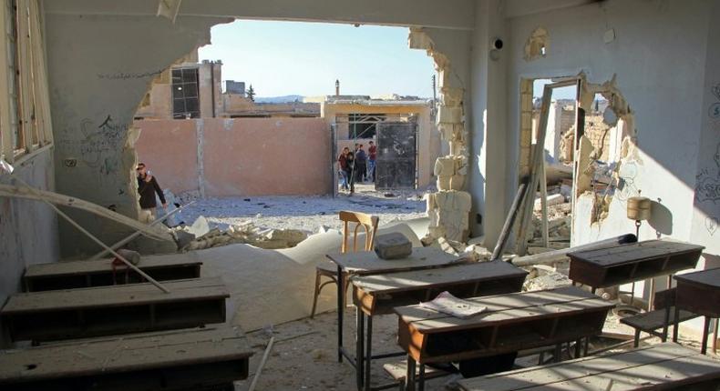 A damaged classroom at a school after it was hit in an air strike in the village of Hass, in the south of Syria's rebel-held Idlib province on October 26, 2016